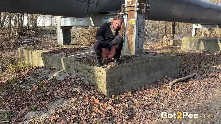 Piss Play Leans Against Pillar for Uninhibited Outdoor Pissing - scat porn video at Scaturia.net